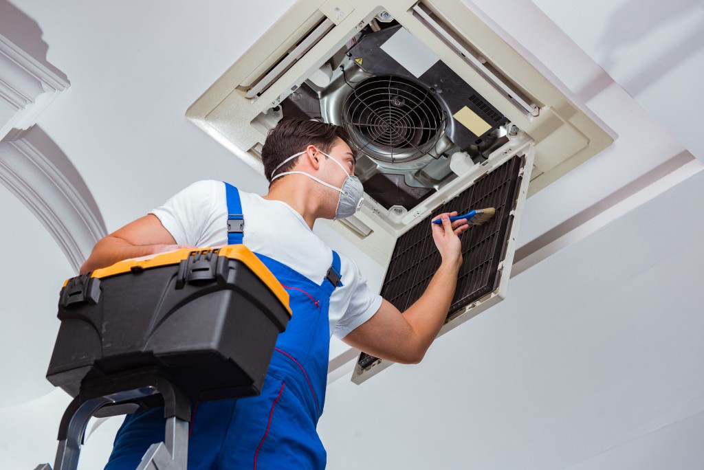 contractor cleaning the aircon