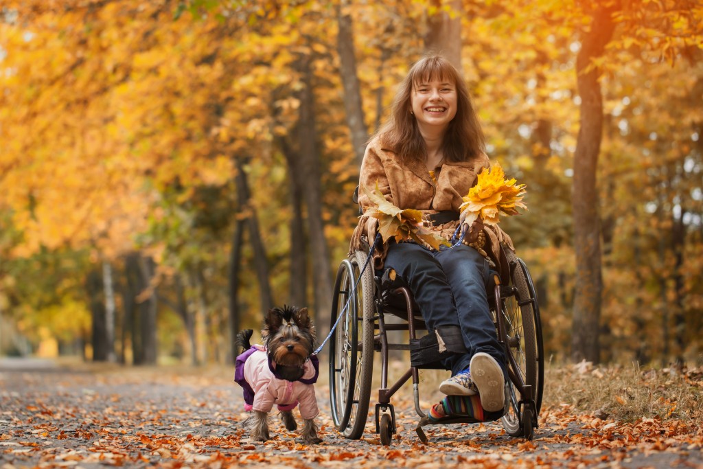 cheerful girl in wheelchair