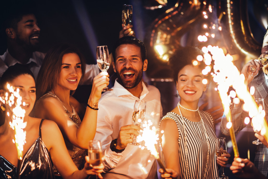 Group of people with champagne and sparklers