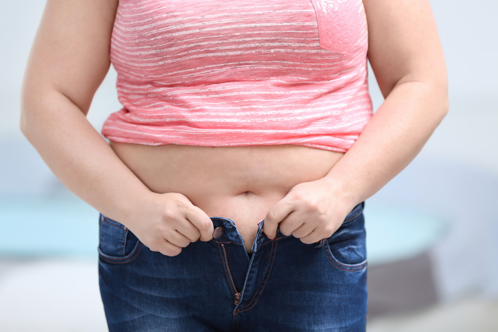 overweight woman wearing jeans