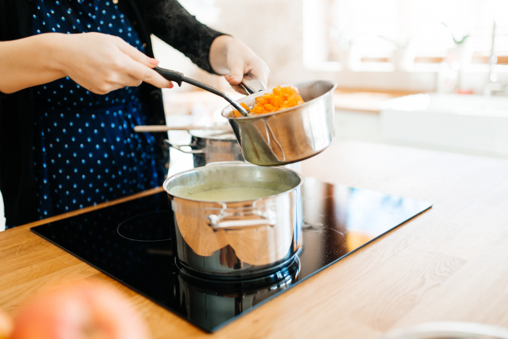 a person cooking macaroni pasta