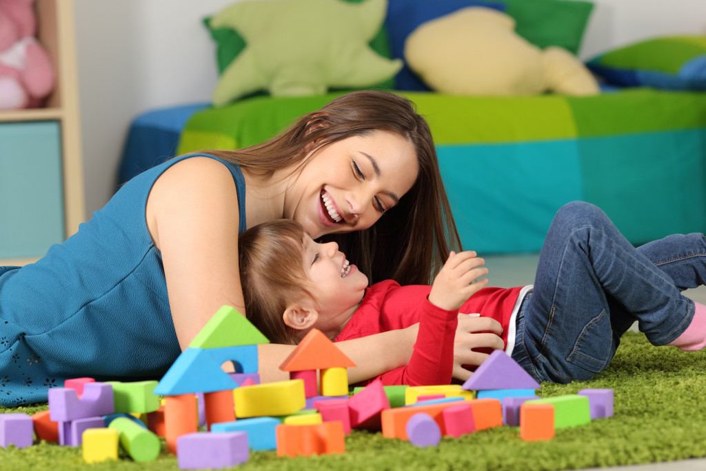 mother and daughter with toys