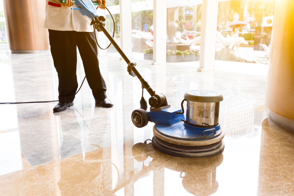 person cleaning the floor