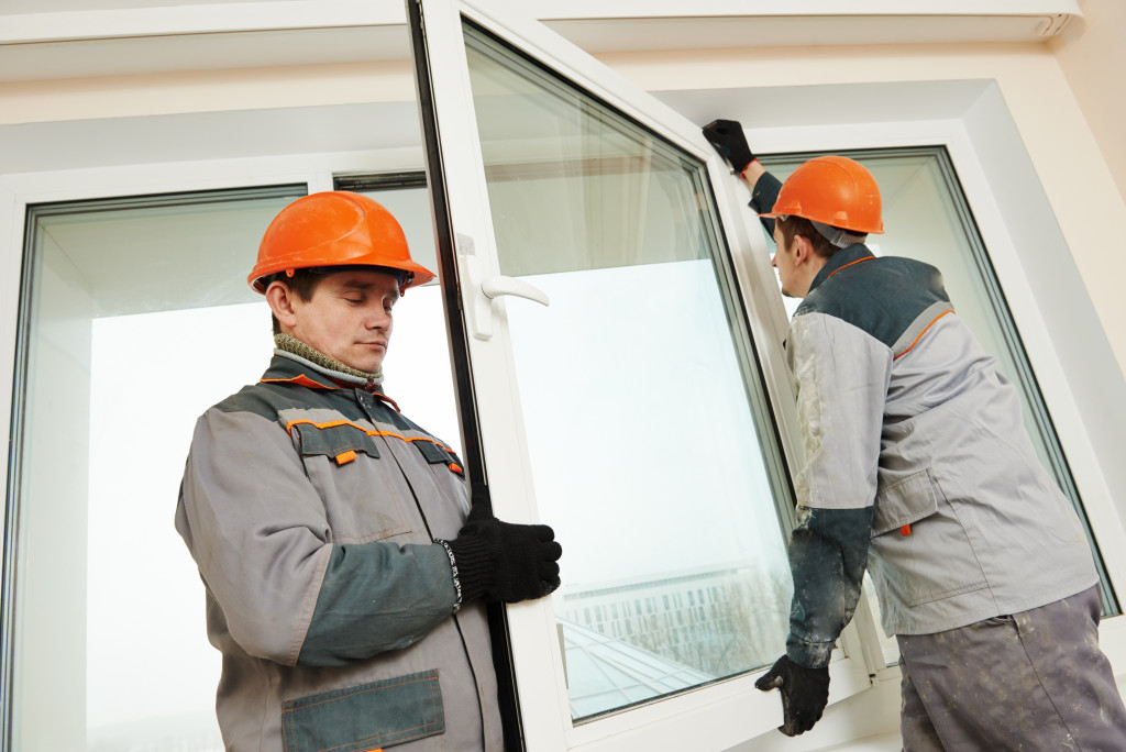 men installing a window