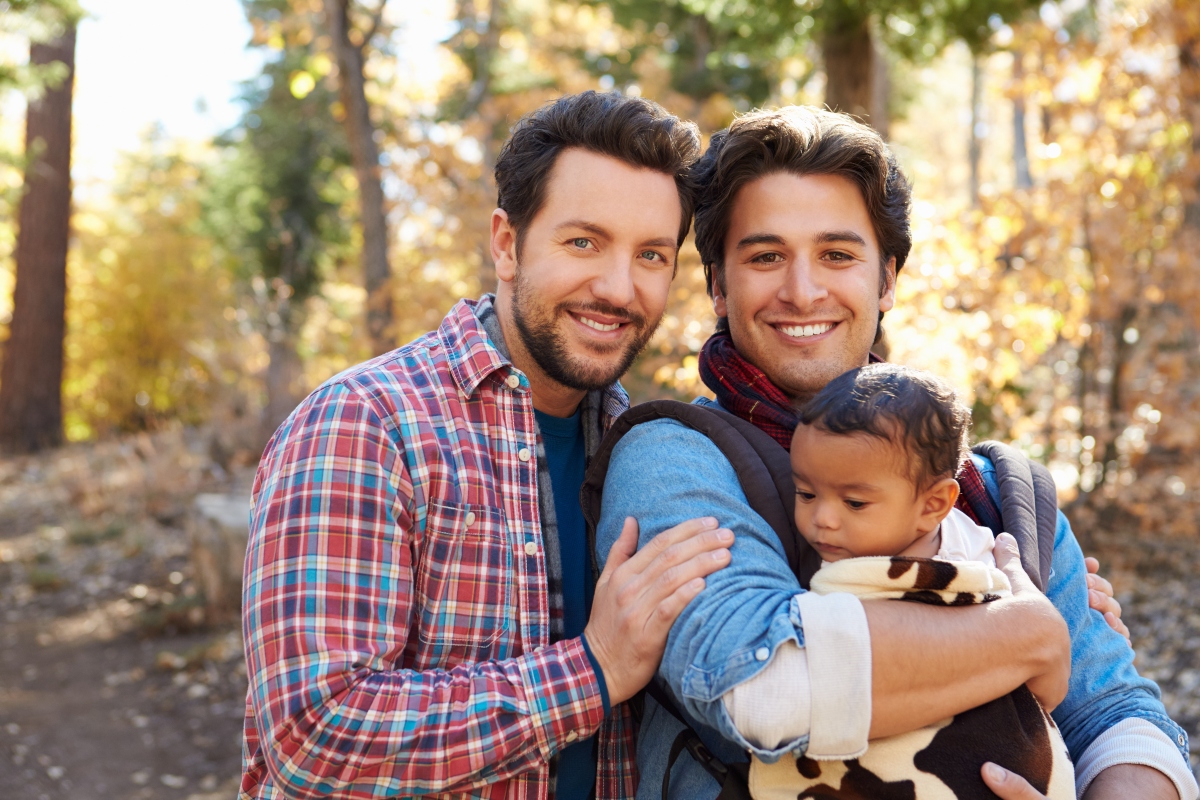 gay couple with adopted child