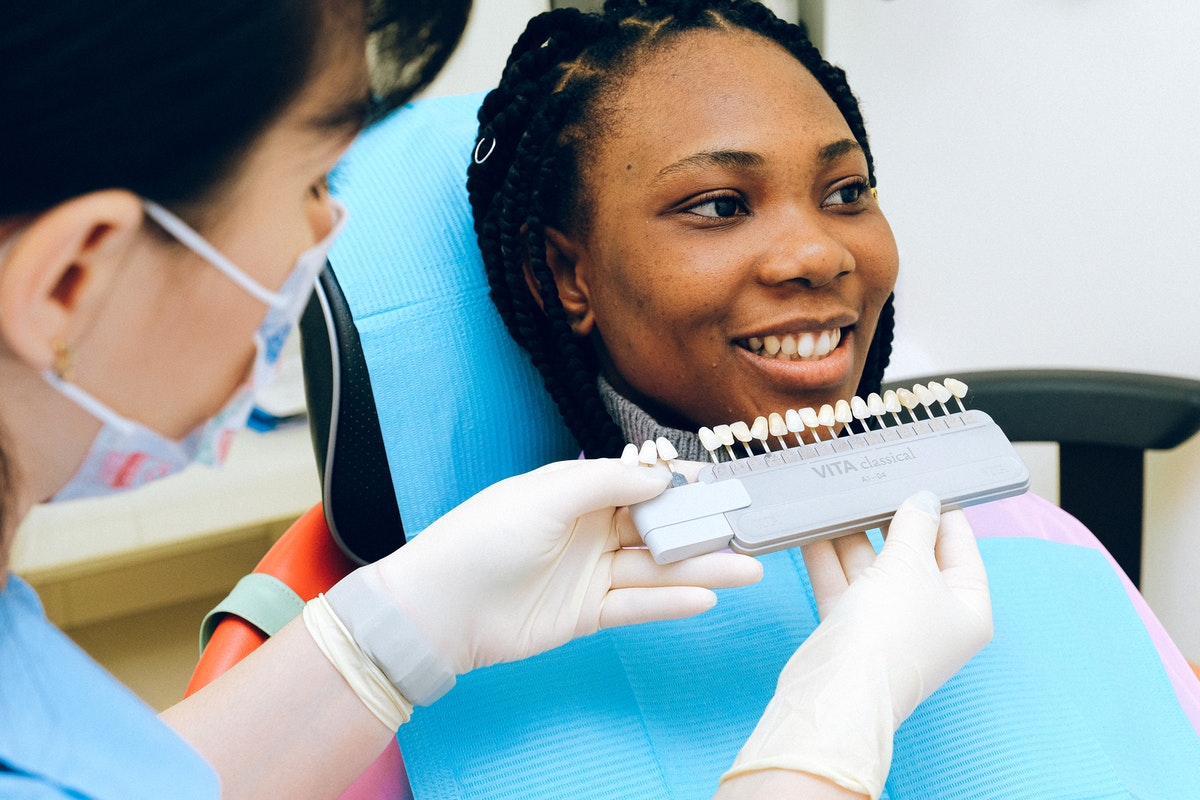 woman getting veneers at the dentist