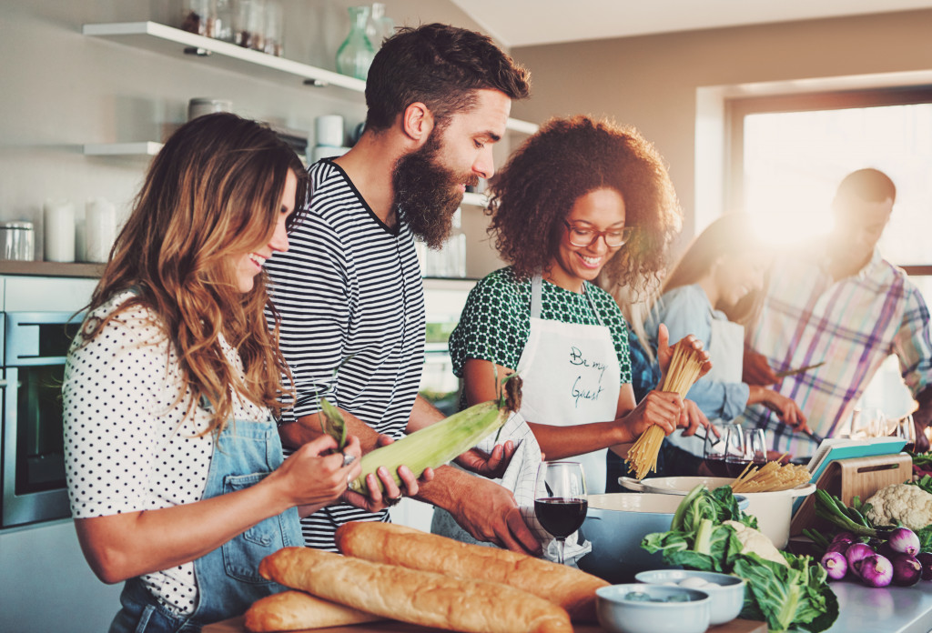 A group of friends cooking together at home