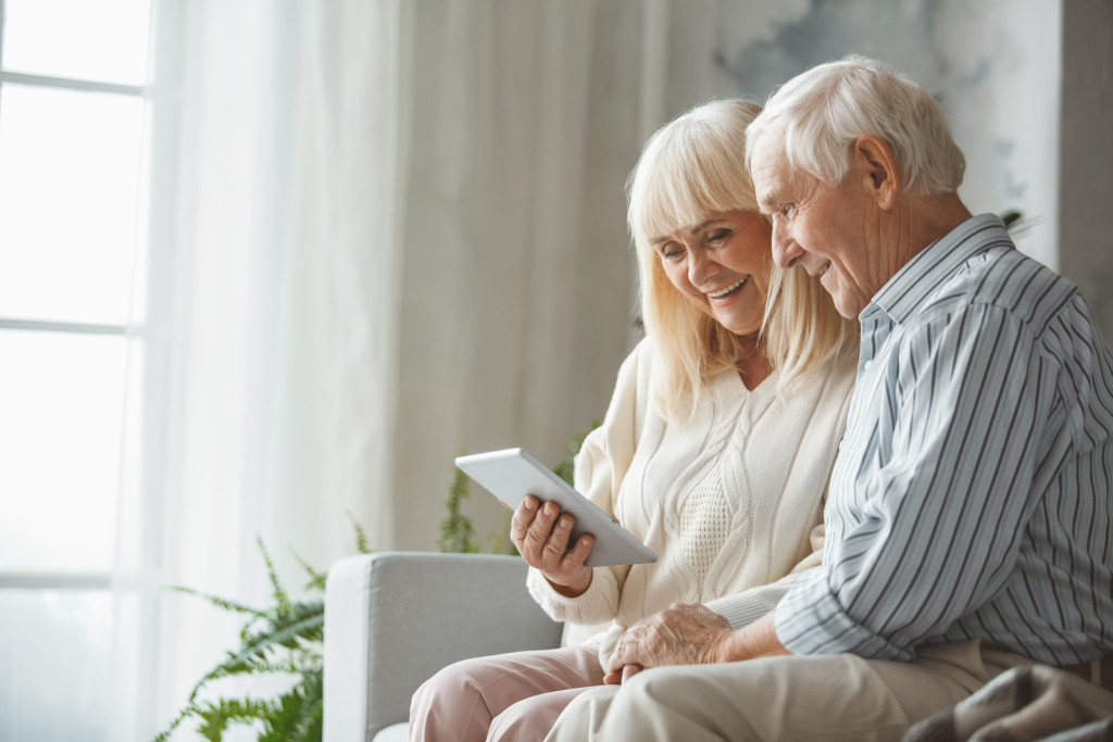 senior couple using a mobile tablet at home