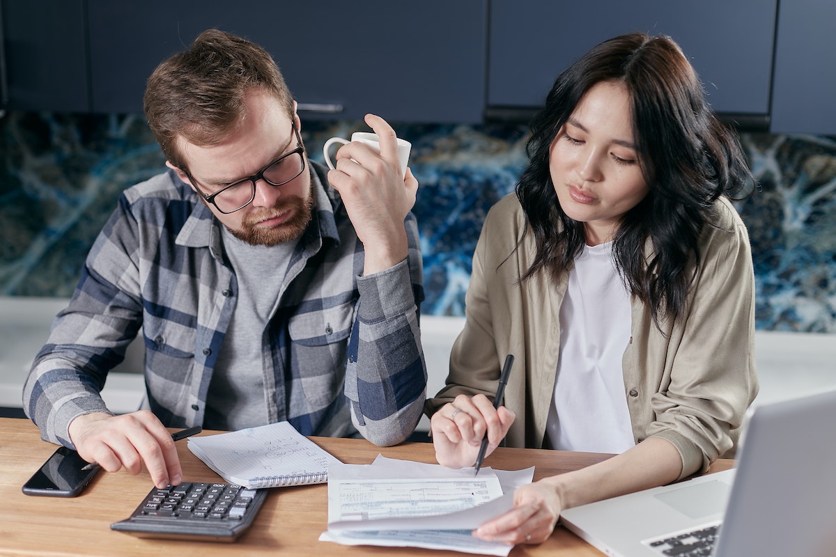 Couple Looking at their Bills