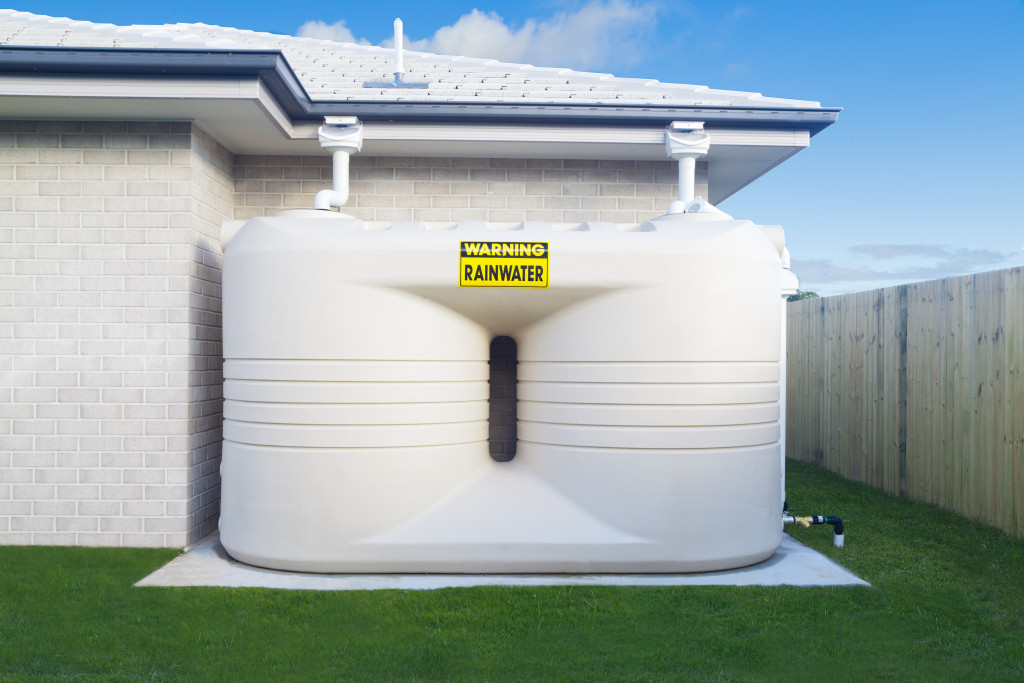 a large rainwater tank in a backyard