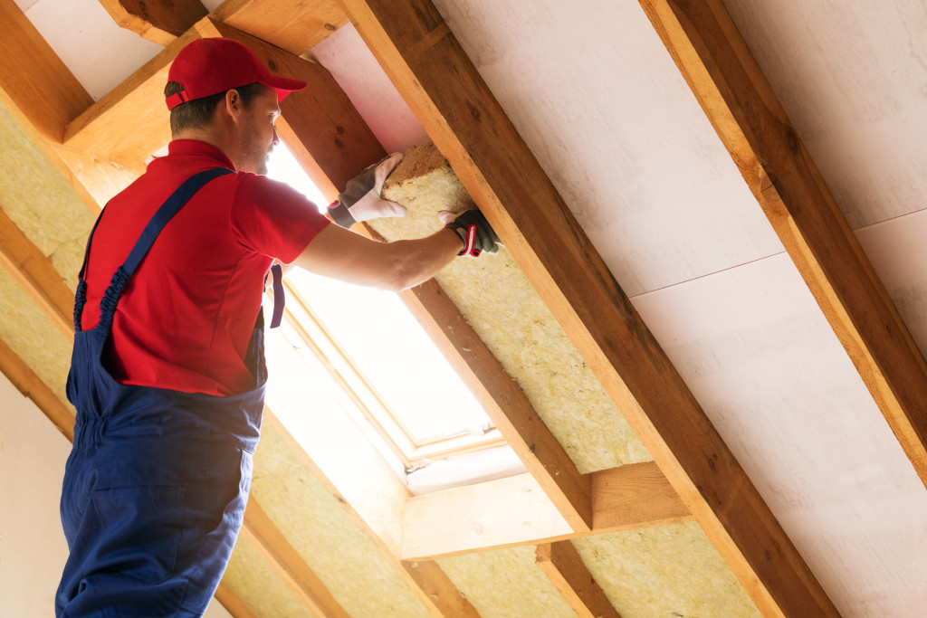 ceiling contractor applying insulation solutions