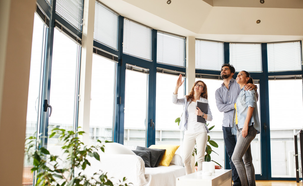 a couple having a house tour with an agent