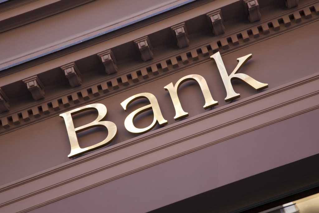 Facade of a bank with a sign. 