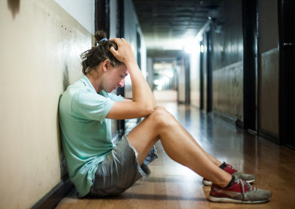 Lonely teenager in the hallway