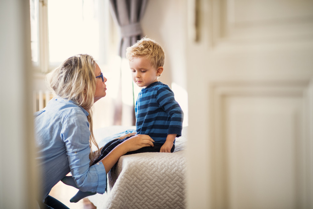 mom communicating with her little son